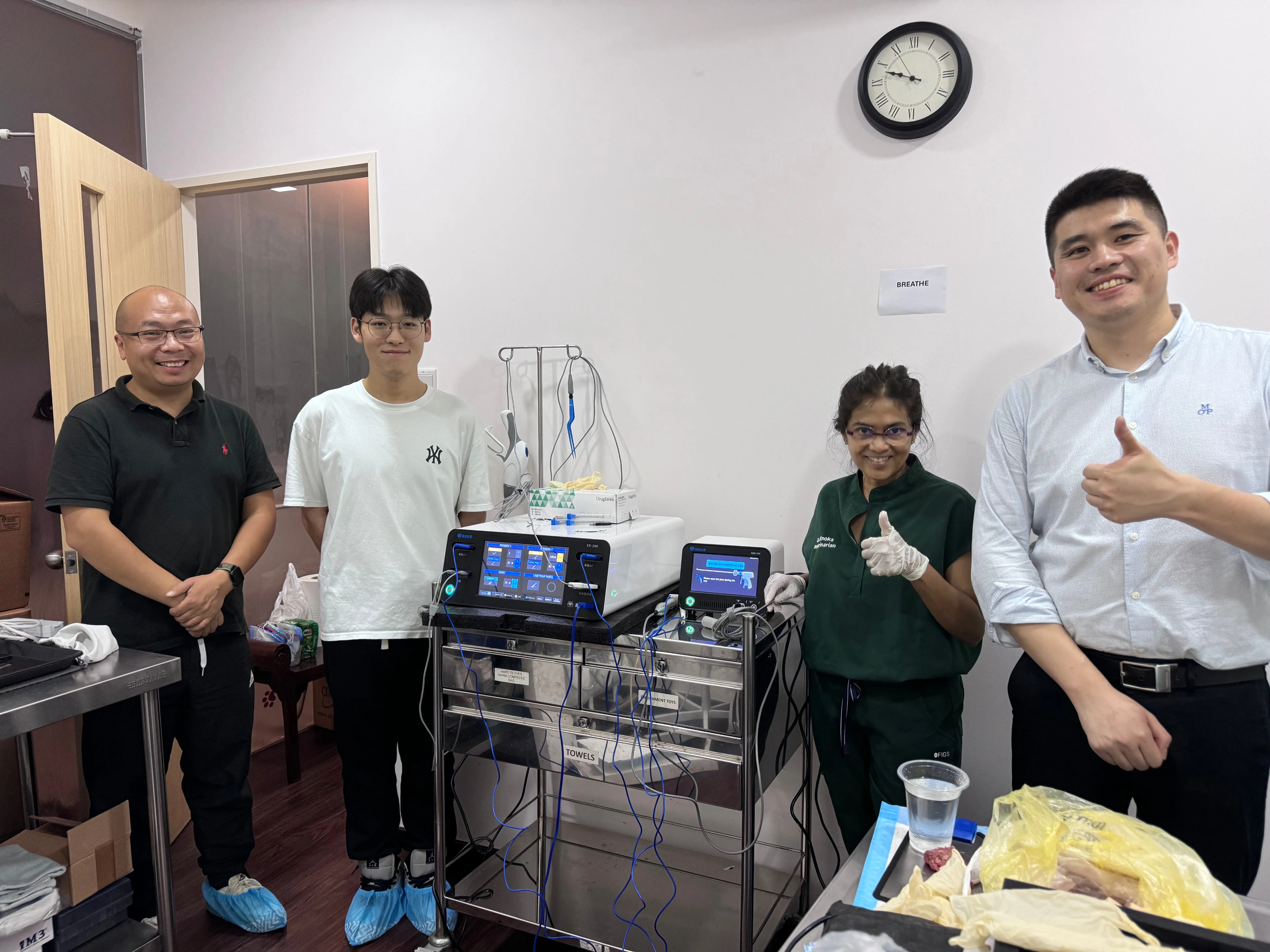Veterinary clinical team with ReinnoVet surgical equipment