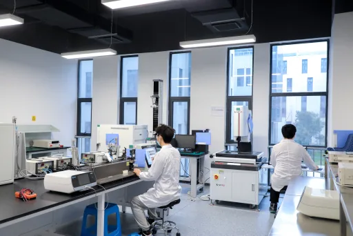 Engineers working with surgical energy system test equipment