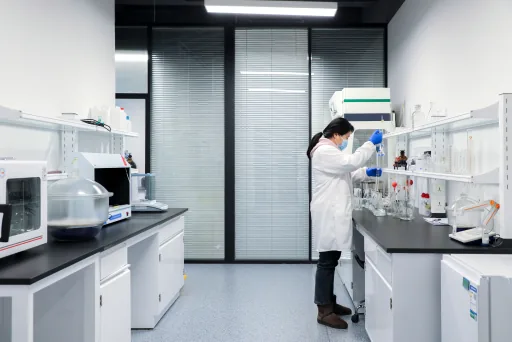 ReinnoVet laboratory workspace with an engineer working at a test bench